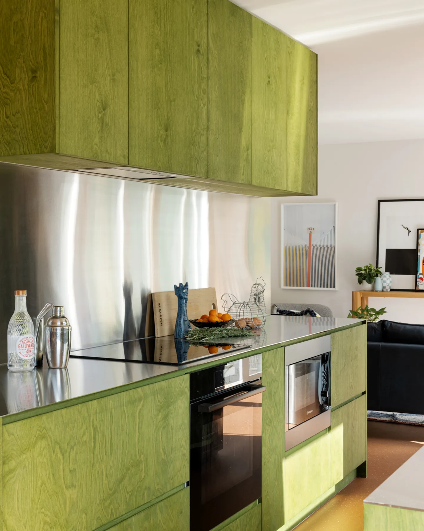 Green Eggs and Ham — olive plywood cabinetry and integrated oven, stainless steel splashback